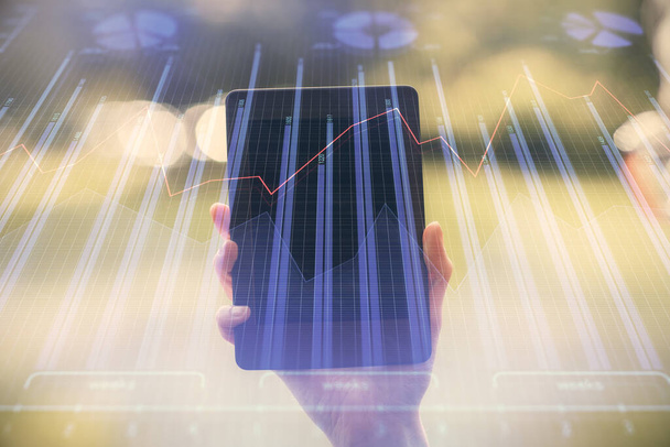 Double exposure of forex chart sketch hologram and woman holding and using a mobile device. Financial market concept. - Фото, зображення