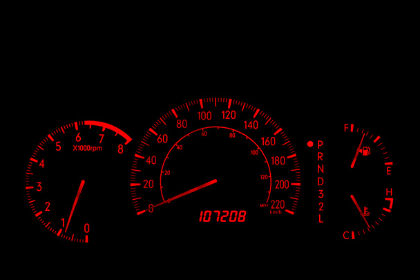 Closeup of an automobile dashboard at night. The dashboard glows orange. There are two speed scales, one in miles and one in kilometers. - Photo, Image