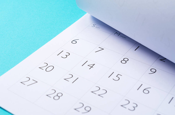 Close-up of a calendar on a blue background - Foto, Imagen