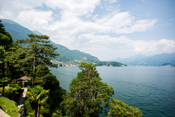 Panorama Lake Como in Italy. View in the Direction of the town Bellagio. Cloudy Sky. - Фото, изображение