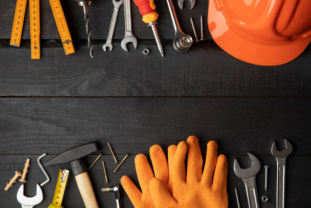 Construction tools on dark wooden background, space for text - Photo, Image