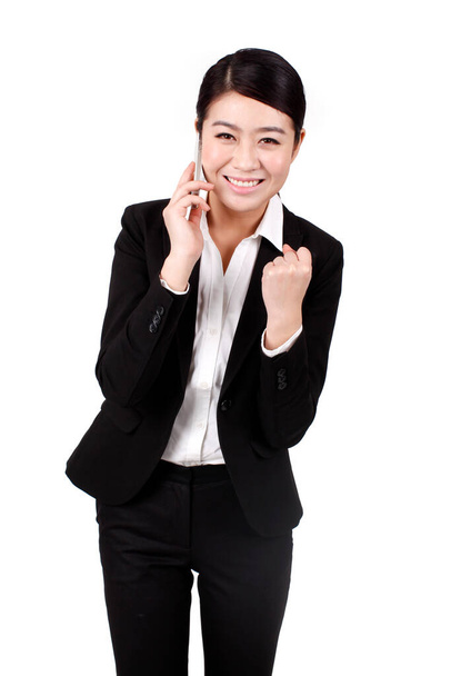 	Businesswoman using a cell phone	 - Zdjęcie, obraz