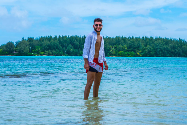 Moreea, French Polynesia:09/03/2018: A beautiful european guy enjoy his holiday on the Paradise island - Photo, Image