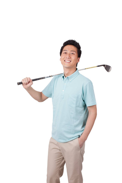 	Young man holding golf swing and smiling 	 - Fotó, kép