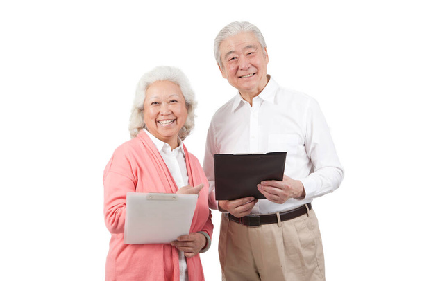 	Senior couple holding questionnaire	 - Φωτογραφία, εικόνα