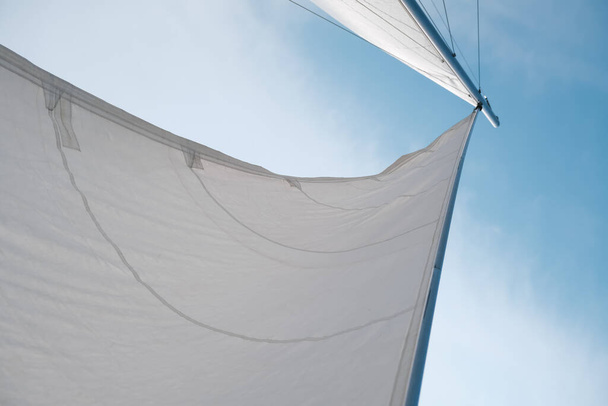 sail on a yacht in the sea against the blue sky - Fotó, kép