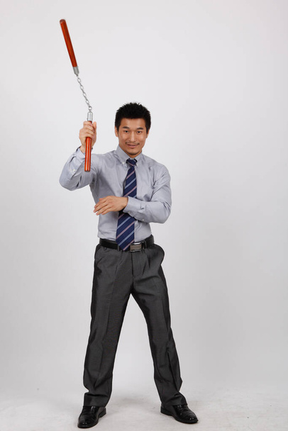 A business man with a double stick - Photo, image