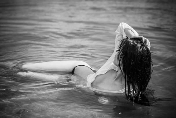 Vacation time. Sensual woman at water. Women's Desire and psychology , relax concept, summer days - Foto, immagini