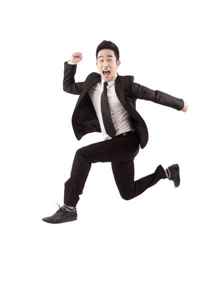 Businessman jumping on white background - Foto, imagen