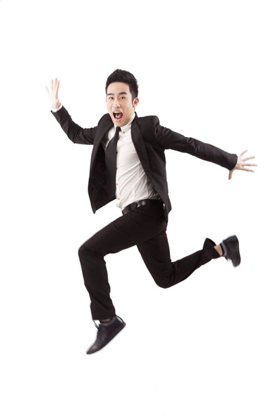 Businessman jumping on white background - Foto, imagen