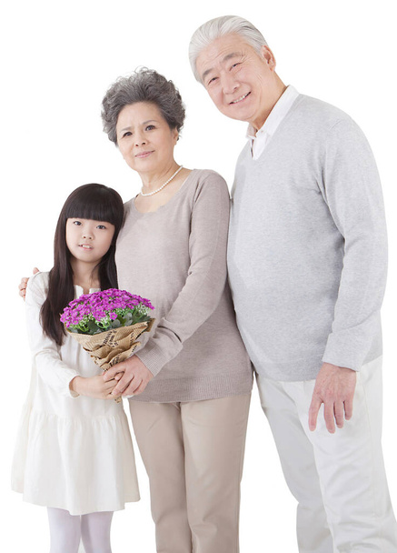Girl and grandparents on white background - Foto, imagen