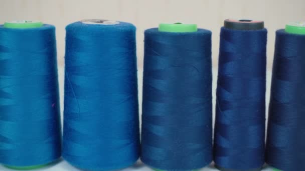 Video of blue bobbins of threads in workshop - Footage, Video