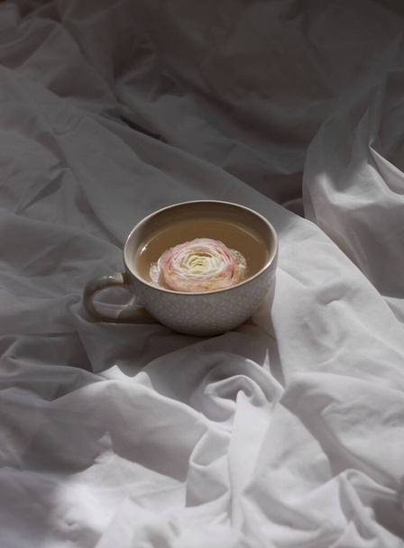 cup of tea with rose on  table - Foto, Imagem
