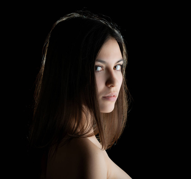 Portrait of a beautiful young brunette. Selective soft focus. - Фото, изображение