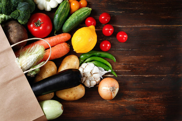assortment of products, vegetables , fruits, in a paper bag ,  autumn cuisine - Foto, Imagem