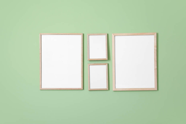 Blank photo frames hanging on wall - Photo, Image