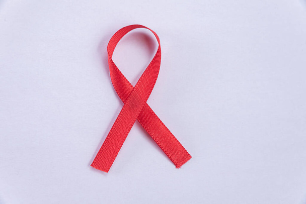 Red ribbon on white background - Foto, imagen