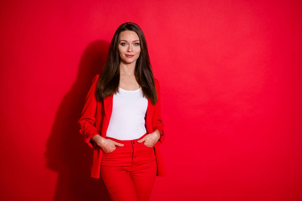 Photo of nice confident pretty business lady arms pockets smiling successful person wear luxury office blazer trousers suit white shirt isolated vibrant red color background - Photo, Image