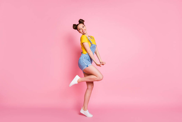 Full length body size profile side view of her she nice attractive pretty shy girlish feminine slim fit cheerful cheery girl jumping having fun posing isolated on pink pastel color background - Photo, Image
