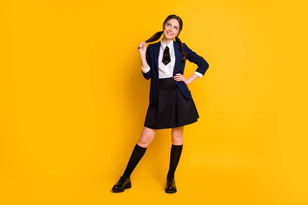 Full length body size view of her she nice attractive pretty charming cute dreamy cheerful cheery schoolgirl learning fantasizing isolated on bright vivid shine vibrant yellow color background - Фото, изображение