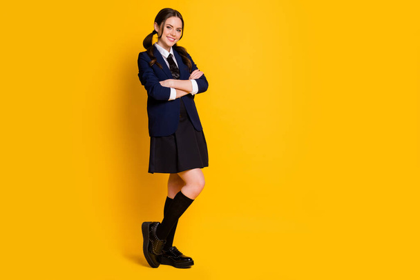 Full length body size view of her she nice attractive pretty lovely cheerful cheery schoolgirl folded arms diligent learner isolated on bright vivid shine vibrant yellow color background - Photo, image