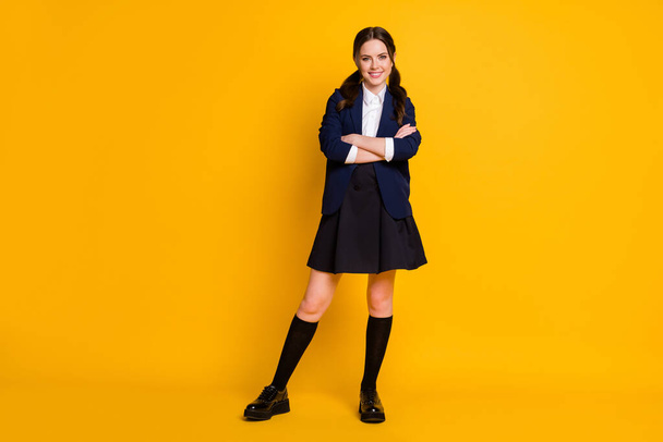 Full size photo of positive successful university student girl cross hands ready get new lesson lecture knowledge material wear uniform isolated bright shine color background - Fotoğraf, Görsel