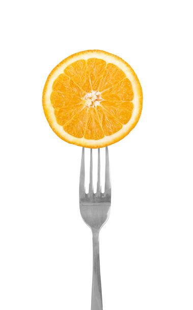 Orange slice on a fork - Φωτογραφία, εικόνα