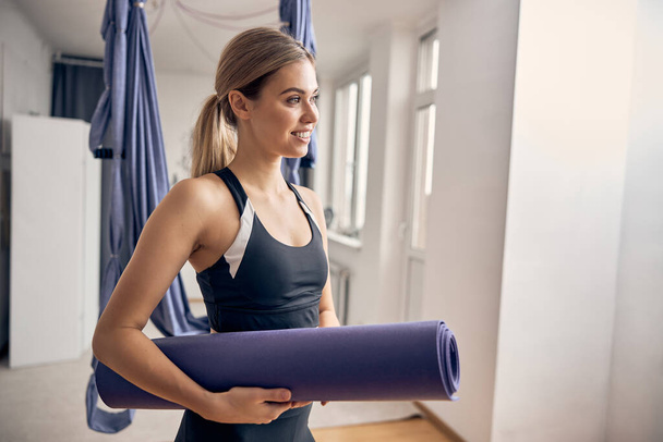 Young blond lady smiling in the gym - Fotografie, Obrázek