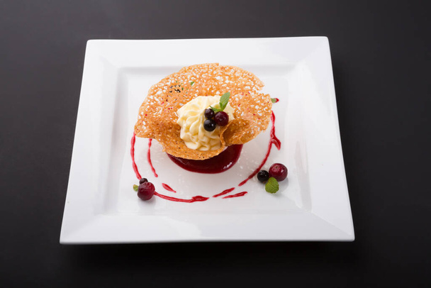 Sweet dessert cream mousse served on white plate - Foto, imagen