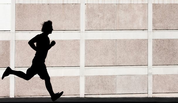 Man runs for exercise - Foto, afbeelding