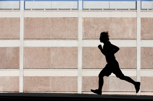 Man runs for exercise - Foto, afbeelding