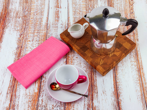 Table setting for coffee. Geyser coffee maker and cup with saucer - Fotografie, Obrázek