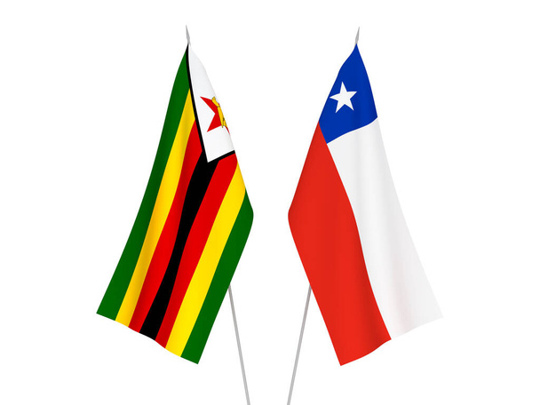 Nationale stoffen vlaggen van Chili en Zimbabwe geïsoleerd op witte achtergrond. 3d weergave illustratie. - Foto, afbeelding