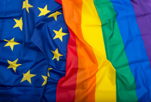Fabric European Union EU and Rainbow flags, concept picture about human rights - Photo, Image