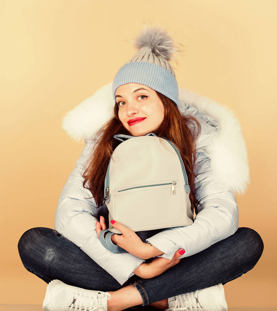 Feeling casual comfortable. Youth style. Casual outfit for modern life. Casual style. Fashion accessory. Girl adorable model with fancy backpack. Little backpack and knitted hat. Blue pastel outfit - Fotoğraf, Görsel