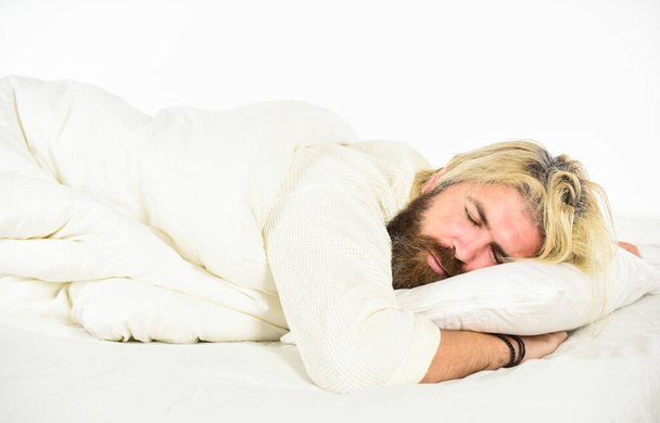 bearded guy wear white terry bathrobe sleeping on bed at hotel bedroom. bed rest while sick. man sleep in underwear. Man in bathrobe in the bathroom. handsome man in the morning. Great time at home - 写真・画像
