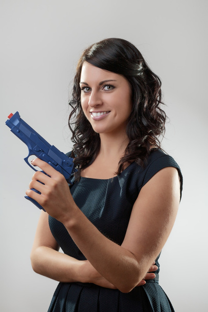 kobieta z toy gun - Zdjęcie, obraz