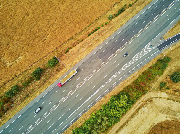 Aerial drone view of beautiful French countryside and six-lane motorway in Brittany, France - Foto, immagini