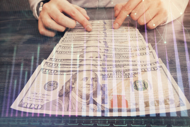 Multi exposure of forex graph drawing hologram and USA dollars bills and man hands. Technical Analysis concept. - Fotó, kép