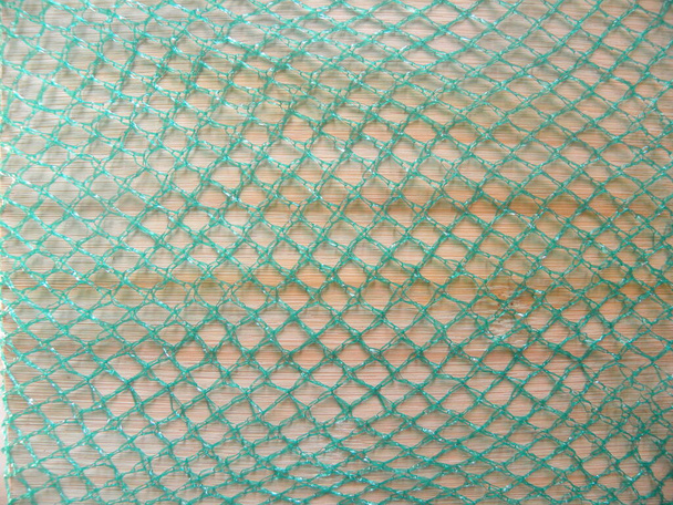 Zöld színű net táska texturált háttér - Fotó, kép