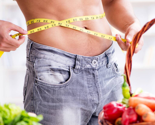 Young man in healthy eating and dieting concept - Photo, image