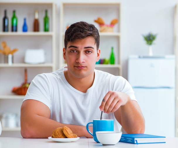 Man falling asleep during his breakfast after overtime work - Photo, Image
