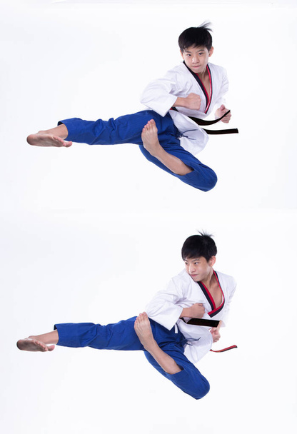 Master Black Belt TaeKwondo karate kansallinen urheilija nuori teini näyttää perinteinen Taistelu aiheuttaa korkean pyöreä potku urheilumekko, studio valaistus valkoinen tausta eristetty, liike hämärtää jalat käsissä - Valokuva, kuva