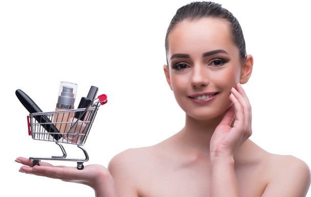 Woman in beauty concept with make up holding shopping cart - Foto, Imagem