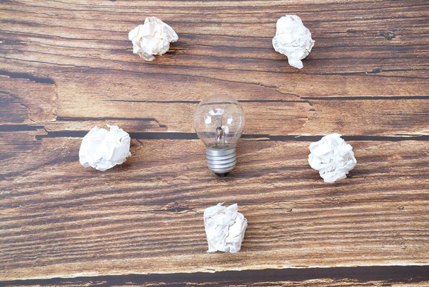 Energy saving light bulb with crumpled paper, new ideas innovation concept - Photo, Image