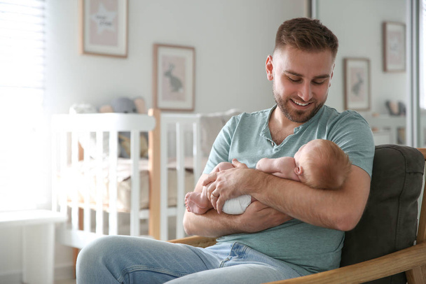 Father with his newborn son at home - Photo, image