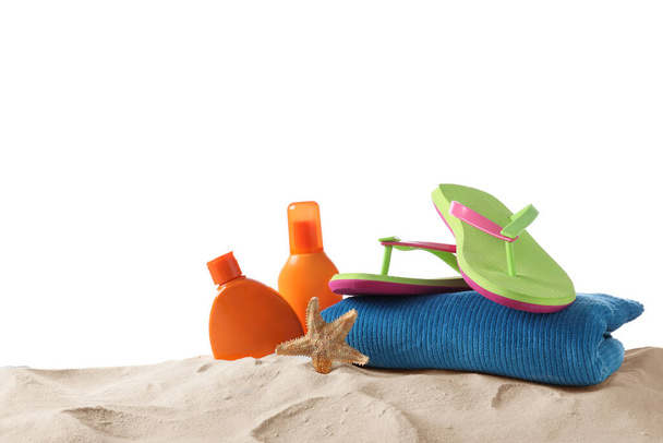 Composition with beach objects on sand against white background - Zdjęcie, obraz