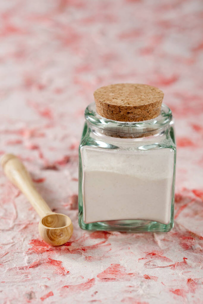 Small jar of flour with a little wooden spoon - Zdjęcie, obraz
