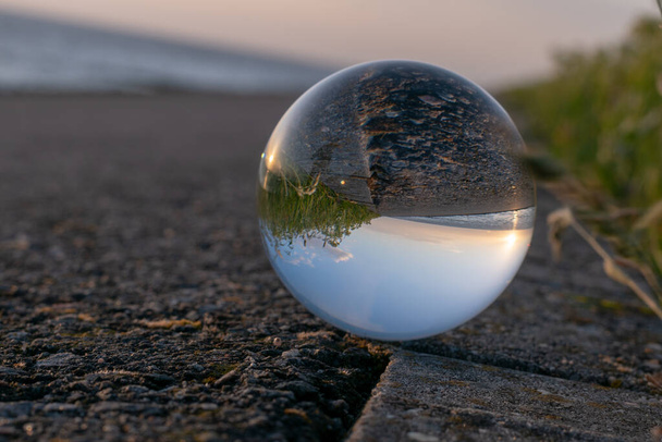 A beautiful shot of a crystal ball with a blurred background - Фото, изображение