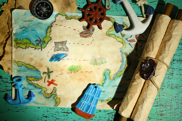 Treasure map with sea accessories, on wooden background - Photo, image